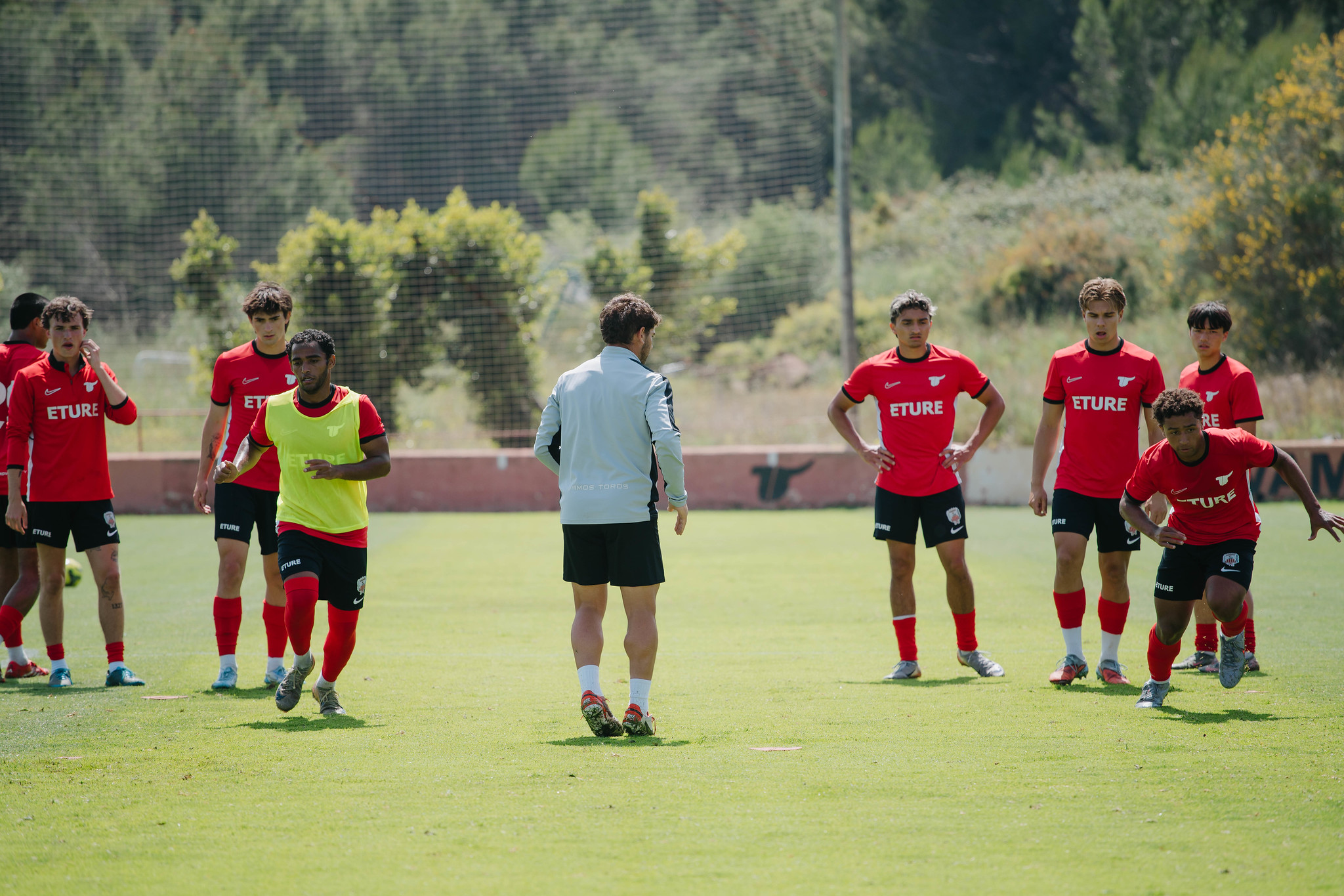 ETURE FC players warming up before training