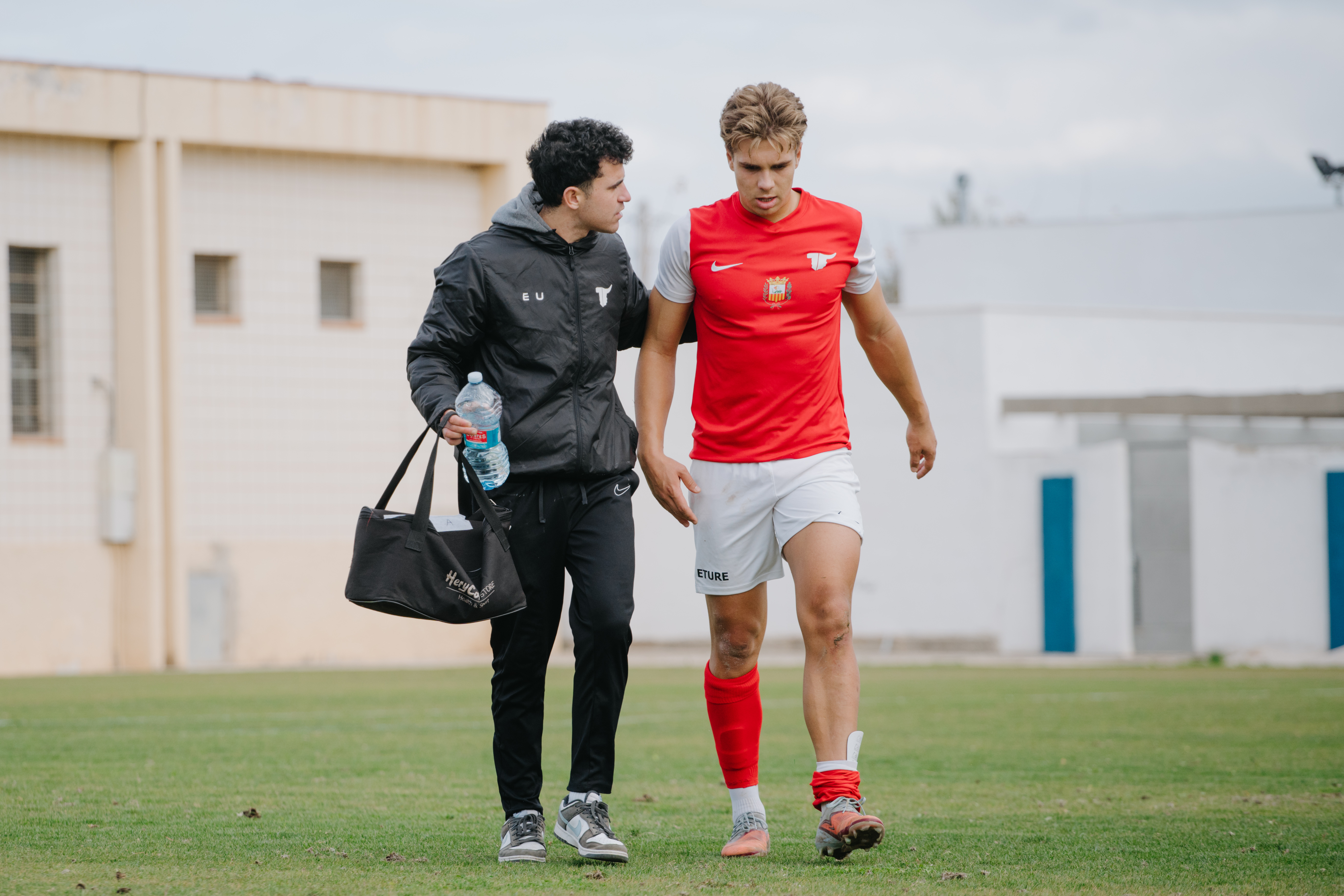 Player receiving physio support on the field
