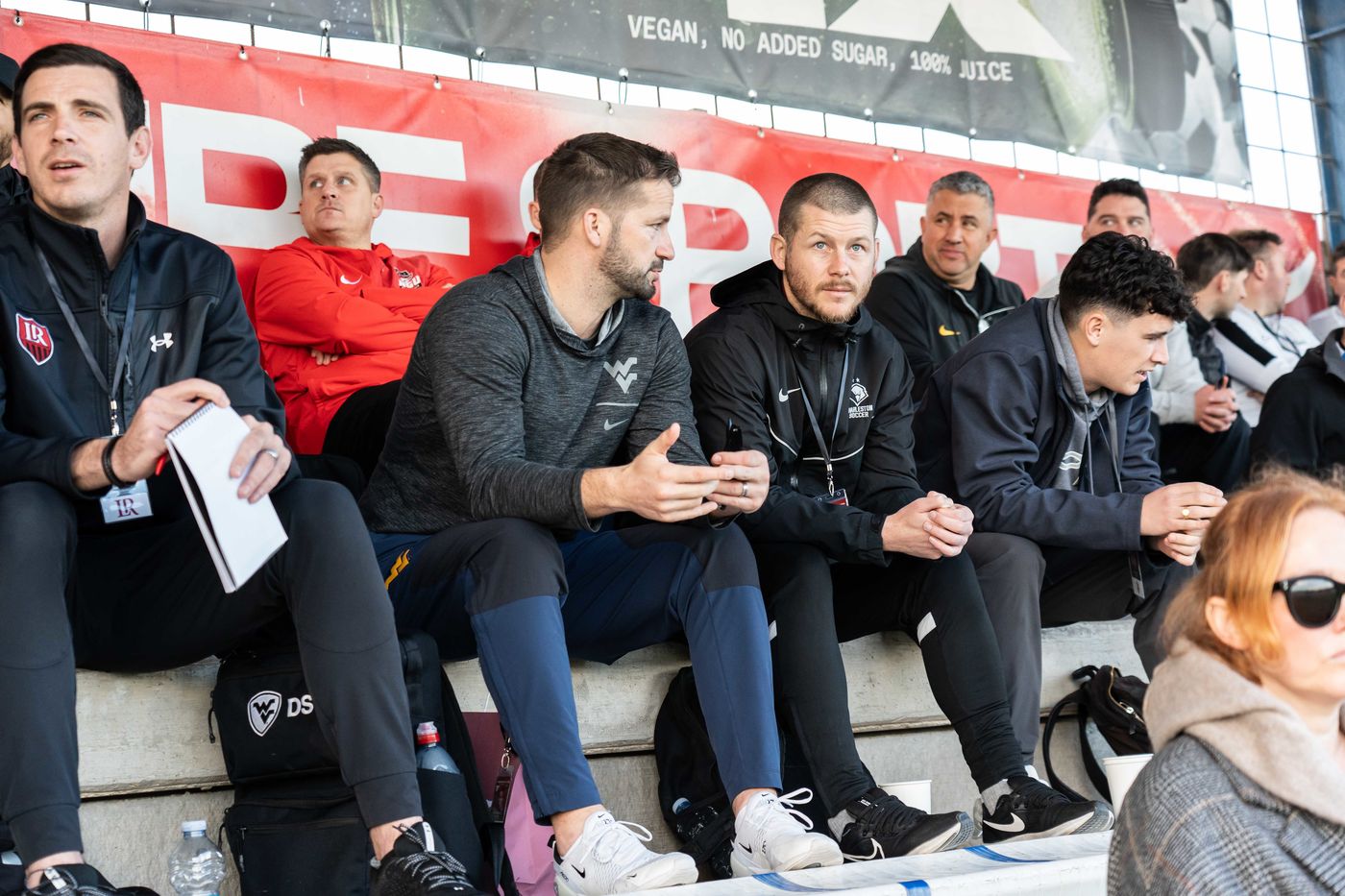 ETURE coaching staff at a match